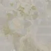 Gładki Onyx w odcieniach bieli i beżu z naturalnym wzorem, idealna do eleganckich wnętrz i blatów kuchennych.